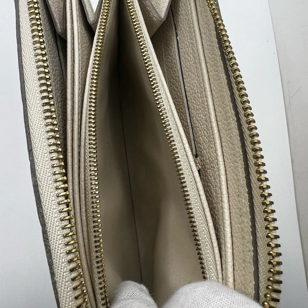 GUC Louis Vuitton Monogram Cream Empreinte Zippy Wallet - Picture 10 of 11